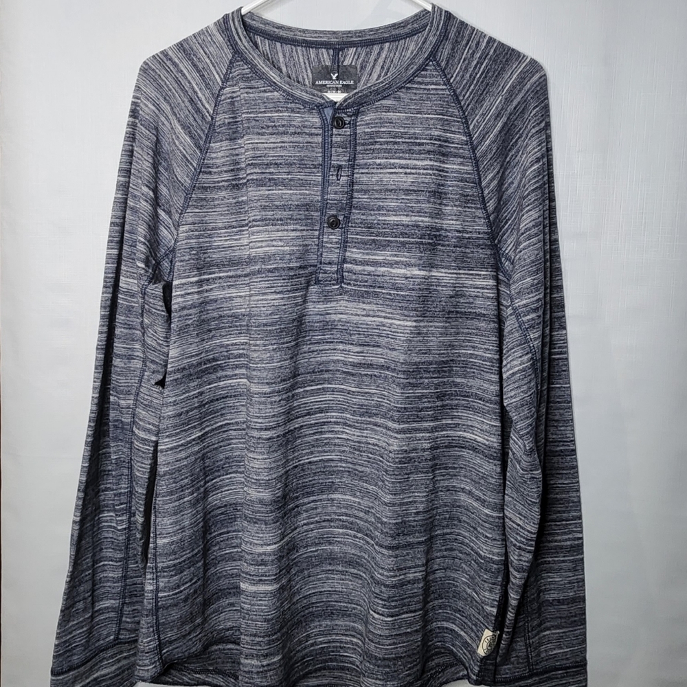 Long sleeve button down henley.  Thin sweater.